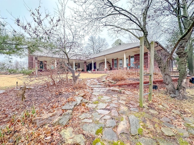 view of front of home with brick siding