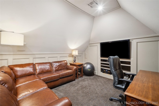 carpeted office space with vaulted ceiling