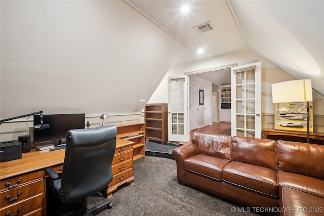 home office featuring lofted ceiling and carpet