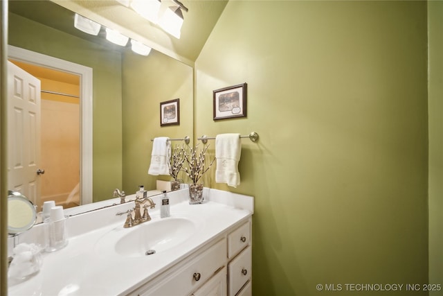 bathroom featuring vanity and a skylight