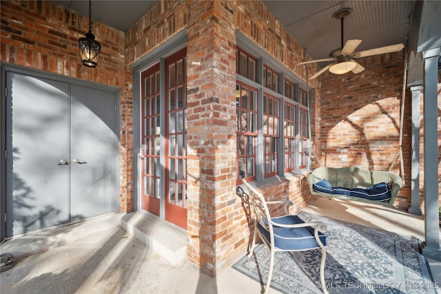 doorway to property featuring french doors and ceiling fan