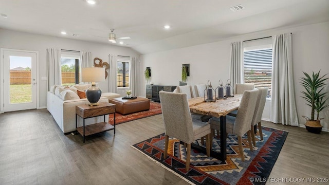 dining room with lofted ceiling, dark wood-type flooring, and ceiling fan