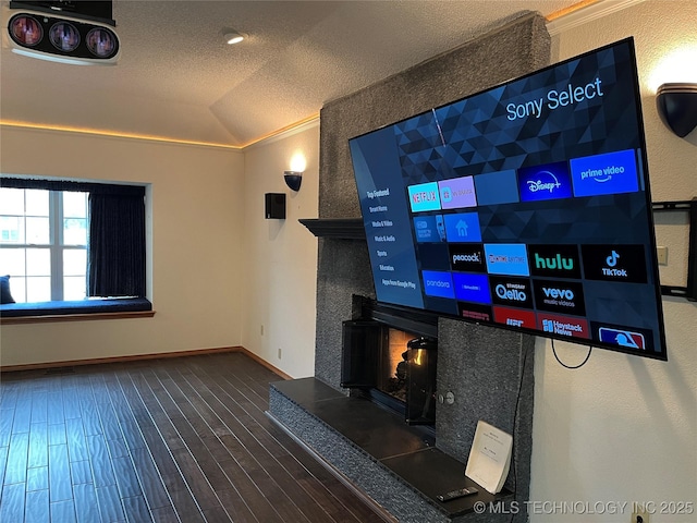 interior space with hardwood / wood-style flooring, vaulted ceiling, and a textured ceiling