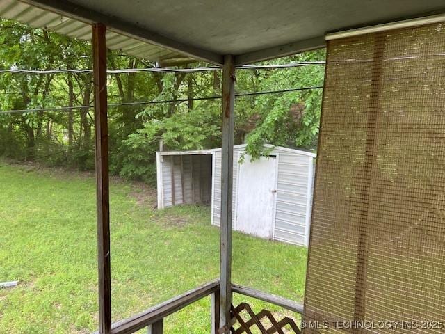 view of yard featuring an outdoor structure and a storage unit