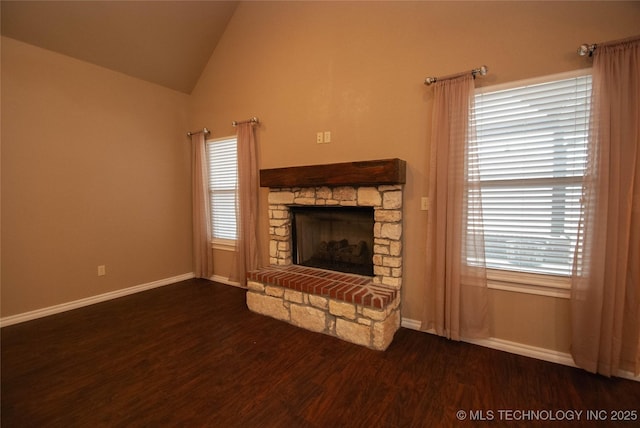 unfurnished living room with dark wood-type flooring, a fireplace, and vaulted ceiling