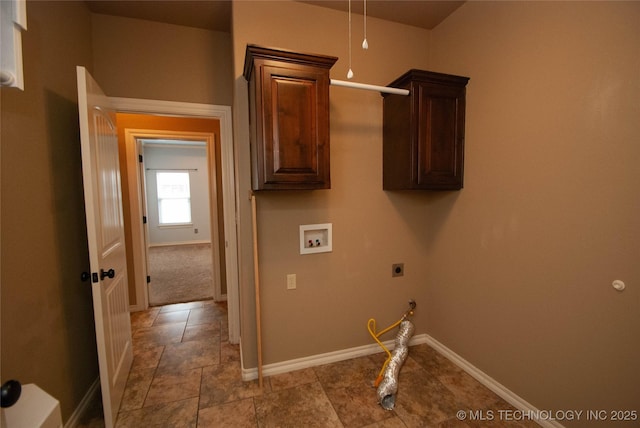 laundry room with electric dryer hookup, washer hookup, cabinets, and gas dryer hookup