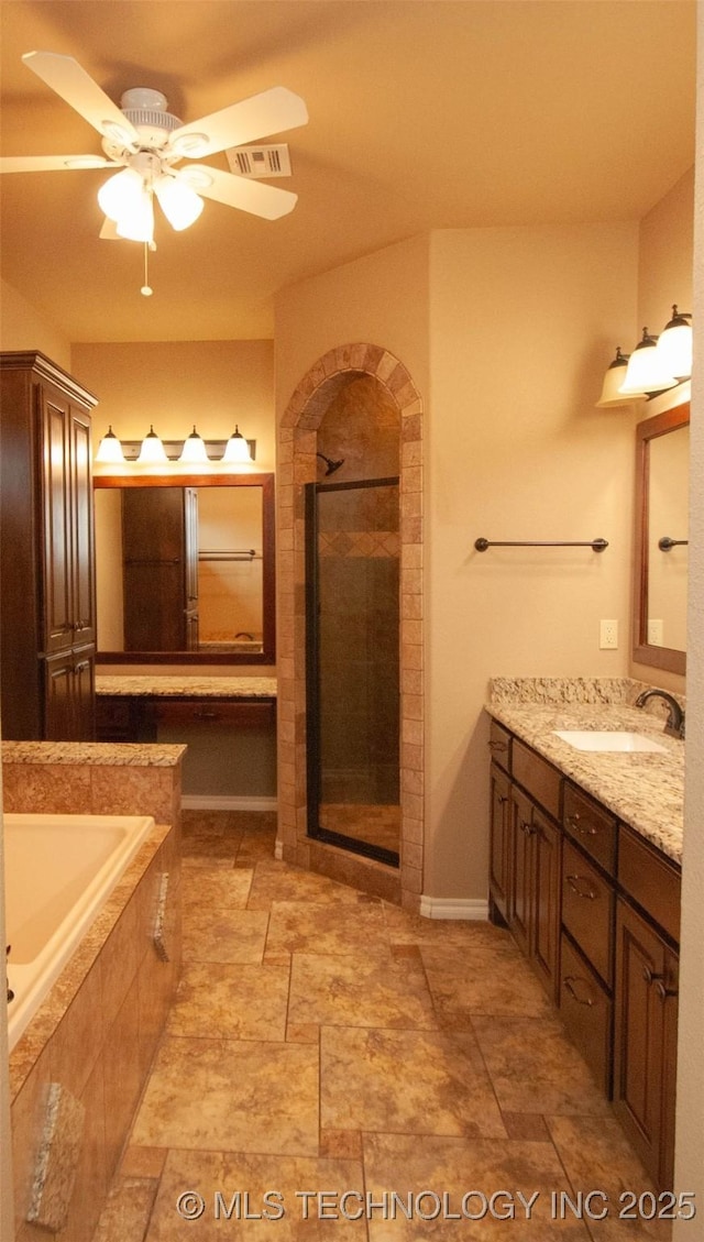 bathroom with ceiling fan, vanity, and independent shower and bath