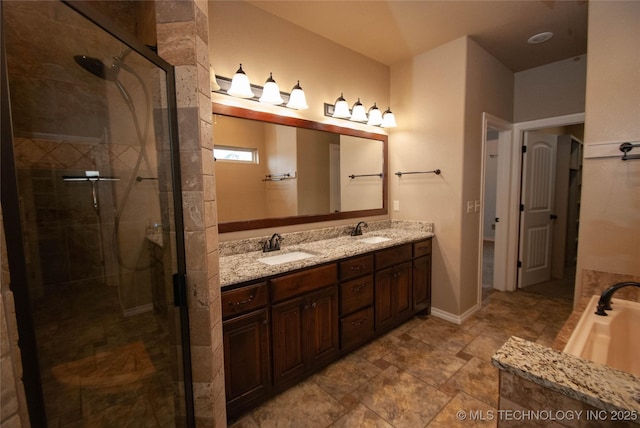 bathroom with vanity and independent shower and bath