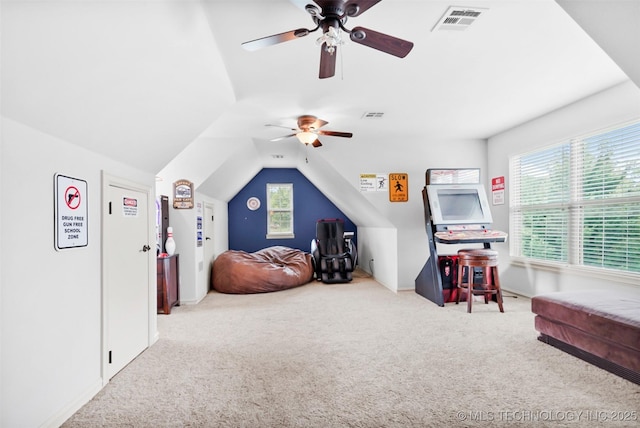 playroom with ceiling fan, lofted ceiling, and carpet