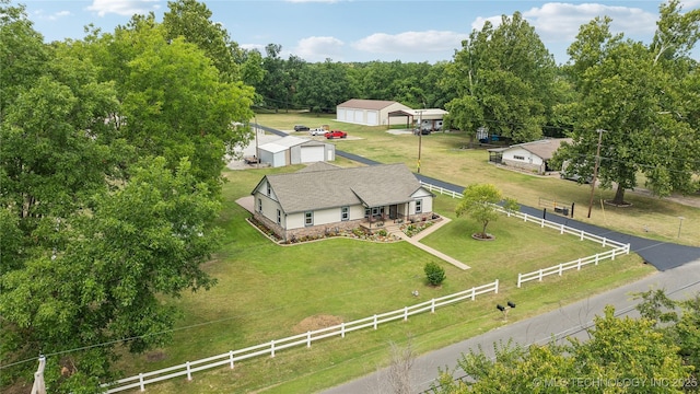 birds eye view of property with a rural view