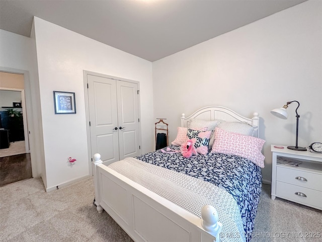 carpeted bedroom featuring a closet