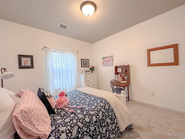 bedroom with light colored carpet