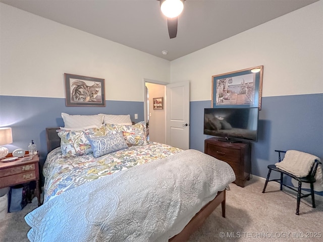 bedroom with ceiling fan and carpet floors