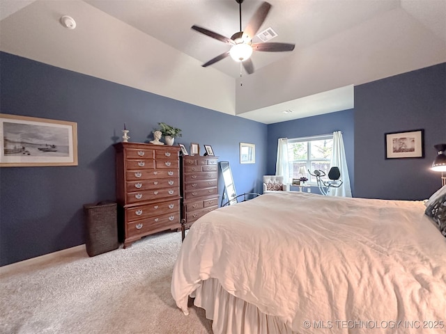 carpeted bedroom with lofted ceiling and ceiling fan