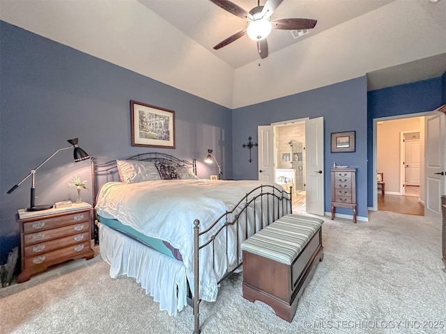 carpeted bedroom featuring ceiling fan and ensuite bathroom