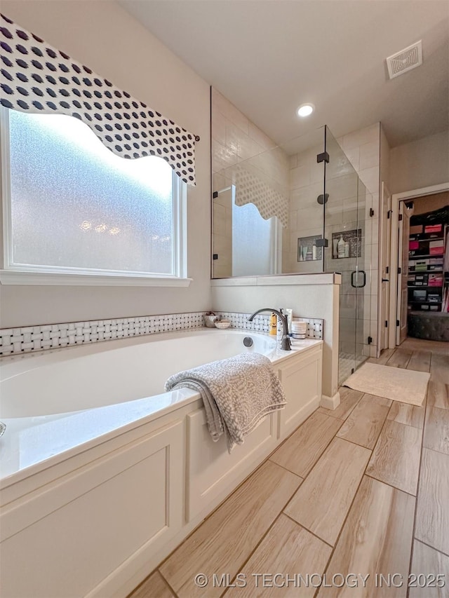 bathroom with independent shower and bath