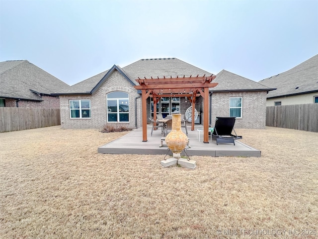 rear view of property with a pergola