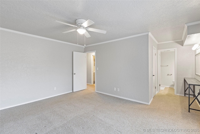 spare room featuring crown molding, ceiling fan, and a textured ceiling