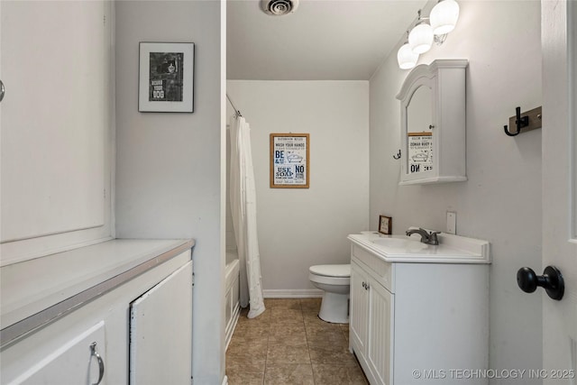 full bathroom with vanity, toilet, tile patterned flooring, and shower / tub combo