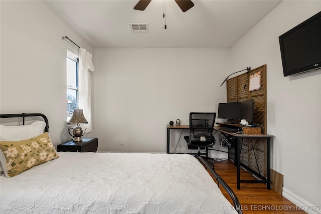 bedroom featuring hardwood / wood-style floors and ceiling fan