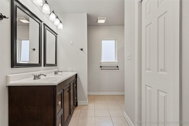 bathroom featuring tile patterned flooring and vanity