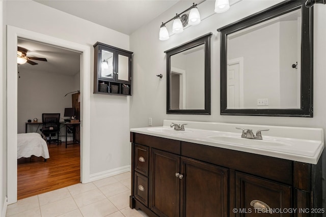 bathroom with ceiling fan, tile patterned floors, and vanity