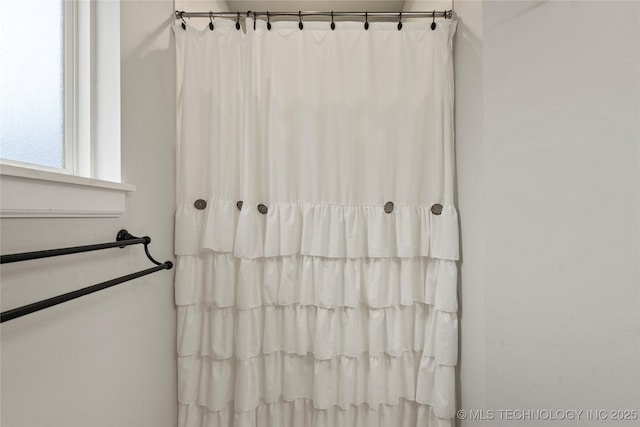 bathroom with a shower with curtain