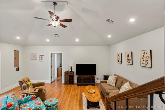 living room with ceiling fan, vaulted ceiling, and light hardwood / wood-style flooring