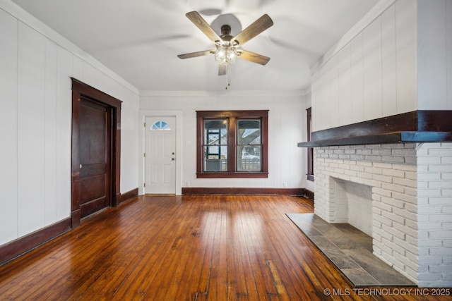 unfurnished living room featuring dark hardwood / wood-style flooring, a fireplace, and ceiling fan