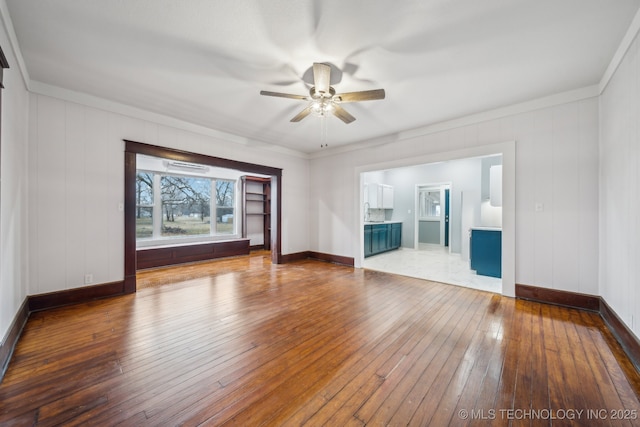 unfurnished room featuring ornamental molding, hardwood / wood-style floors, and ceiling fan