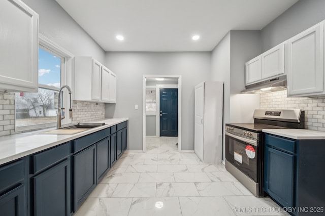 kitchen featuring white cabinetry, blue cabinetry, sink, and stainless steel range with electric cooktop