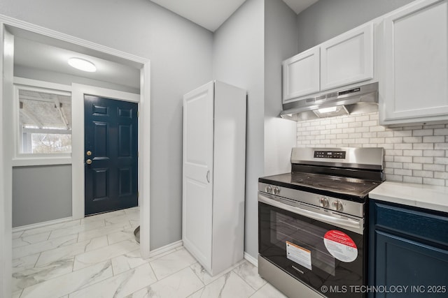 kitchen with electric stove, blue cabinets, decorative backsplash, and white cabinets