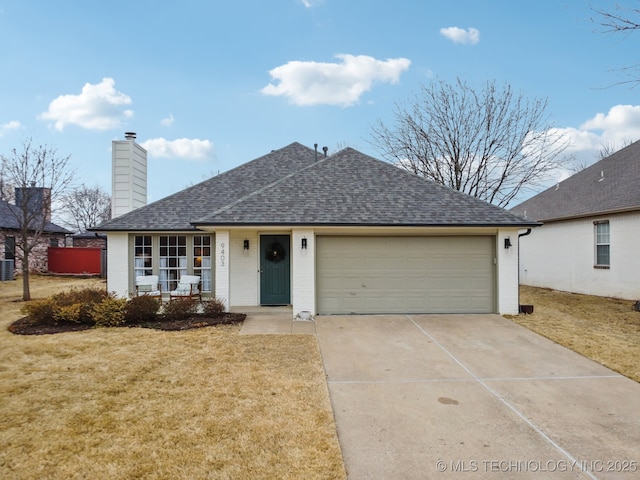 view of front of home featuring central AC unit, a garage, a front yard, and covered porch