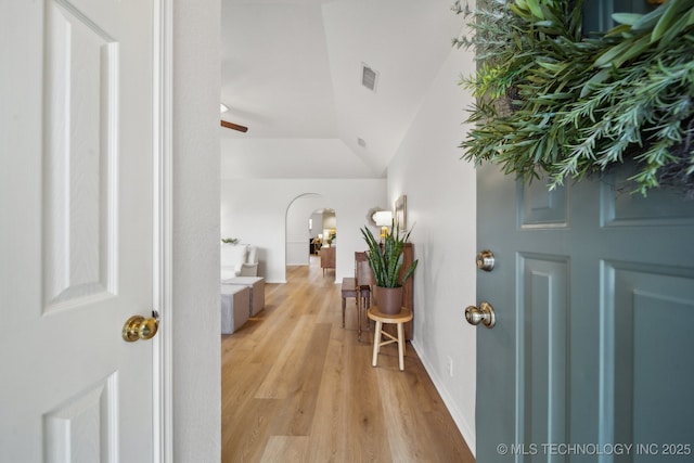 entryway featuring ceiling fan, lofted ceiling, and light hardwood / wood-style floors