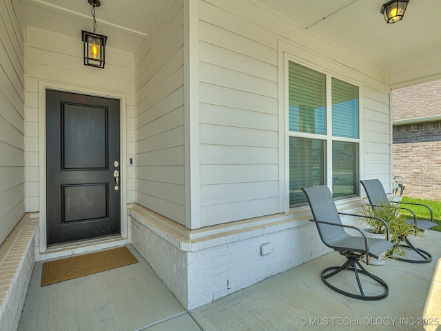 doorway to property featuring a porch