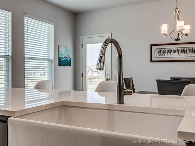 interior space featuring an inviting chandelier and sink