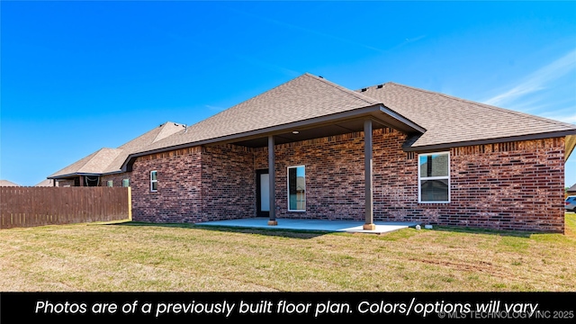 back of property with a patio and a yard