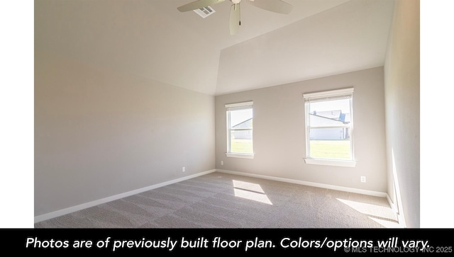 carpeted spare room featuring lofted ceiling and ceiling fan