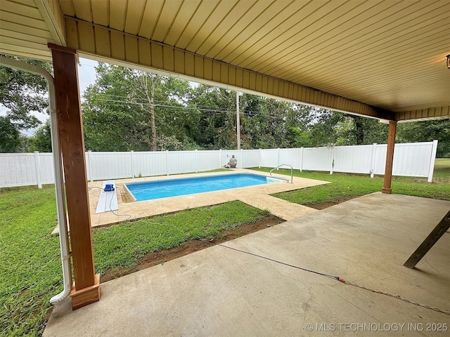 view of pool featuring a yard and a patio area