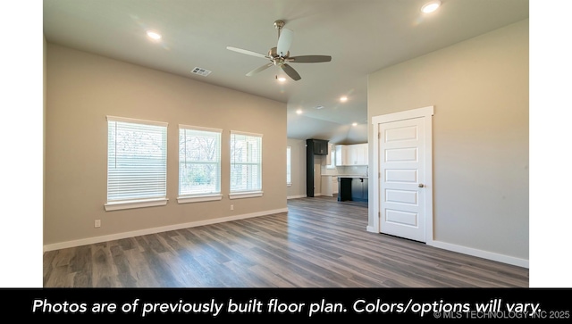 unfurnished living room with ceiling fan, a healthy amount of sunlight, and dark hardwood / wood-style flooring