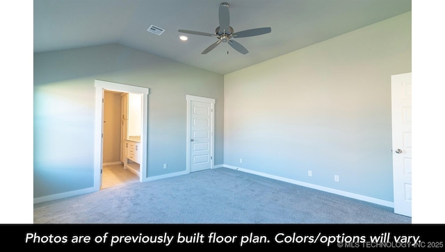 unfurnished bedroom with ensuite bath, vaulted ceiling, ceiling fan, and carpet flooring