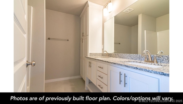 bathroom featuring vanity and tile patterned flooring