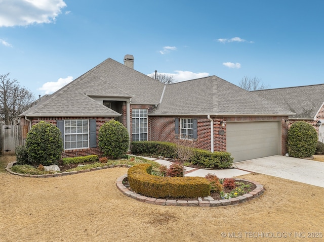 view of front of property featuring a garage and a front yard