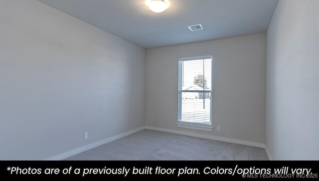 empty room with light colored carpet