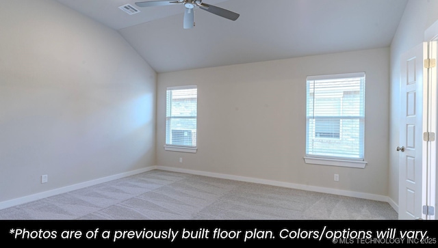 empty room with vaulted ceiling, light carpet, and ceiling fan