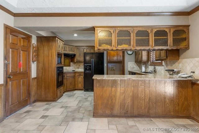 kitchen with black appliances, sink, backsplash, ornamental molding, and kitchen peninsula