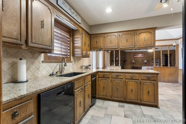 kitchen with sink, tasteful backsplash, dishwasher, kitchen peninsula, and light stone countertops