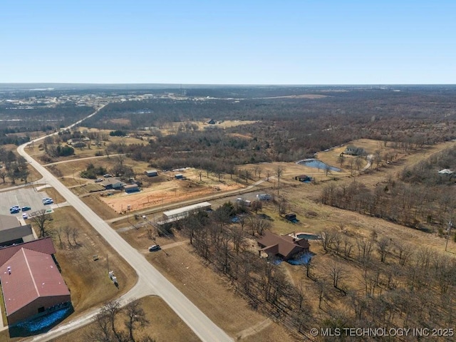 birds eye view of property with a rural view