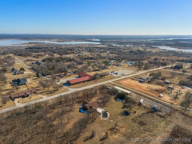 aerial view with a water view and a rural view