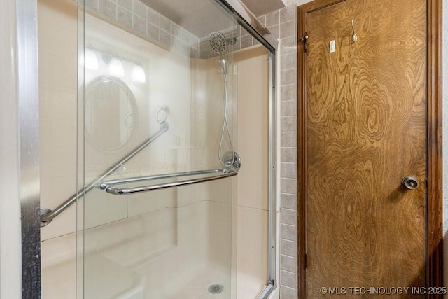 bathroom with a shower with shower door